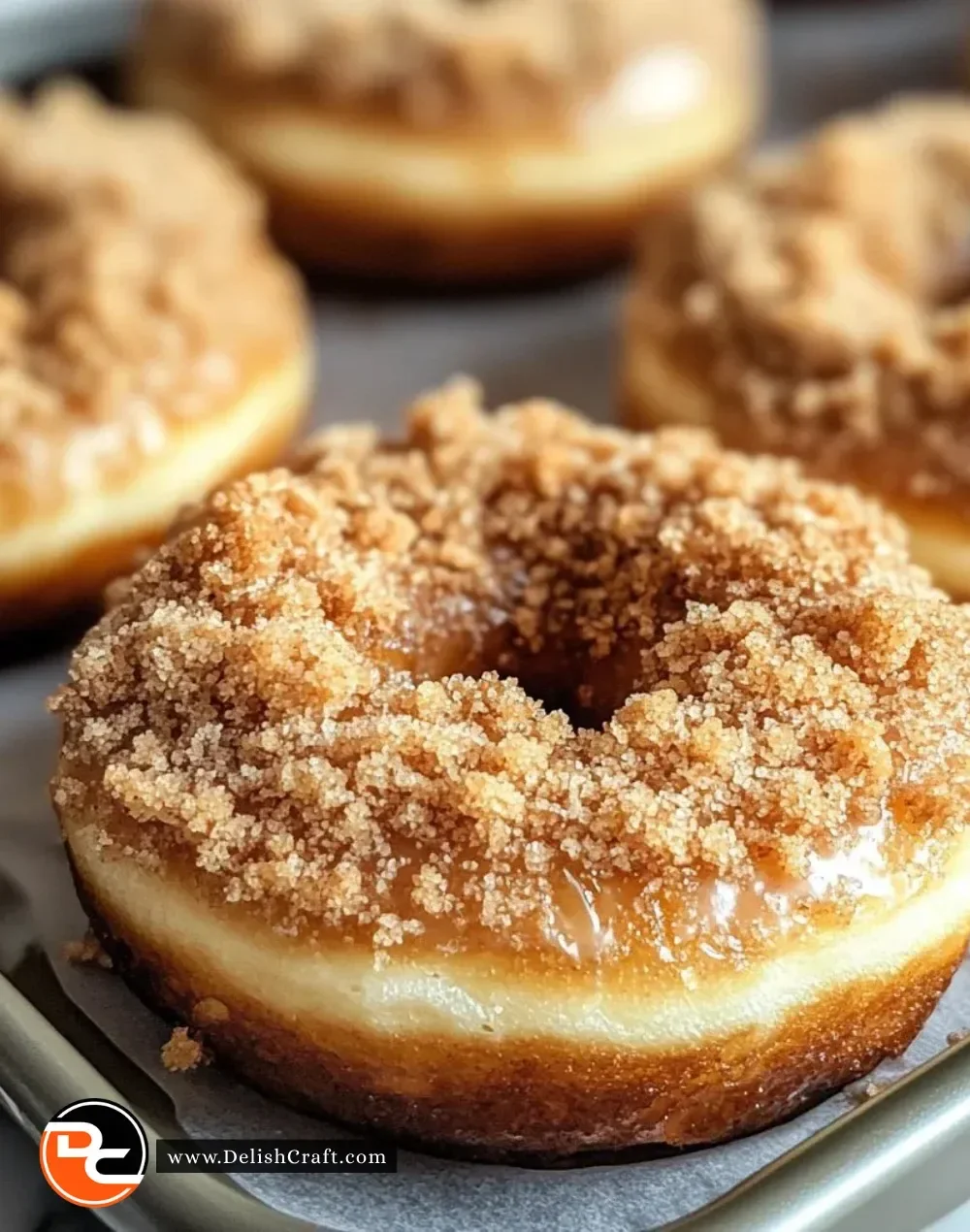 Delicious coffee cake donuts with a cinnamon glaze and sprinkles.