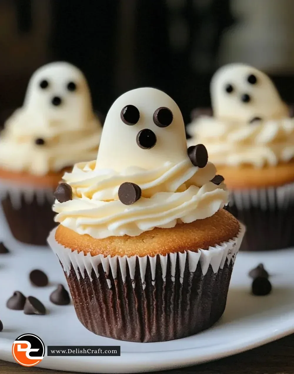 Delicious Halloween ghost cupcakes decorated with edible eyes and frosting