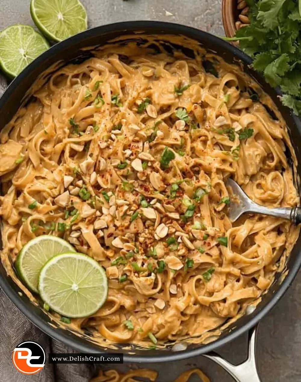 Bowl of easy peanut noodles garnished with vegetables and peanuts