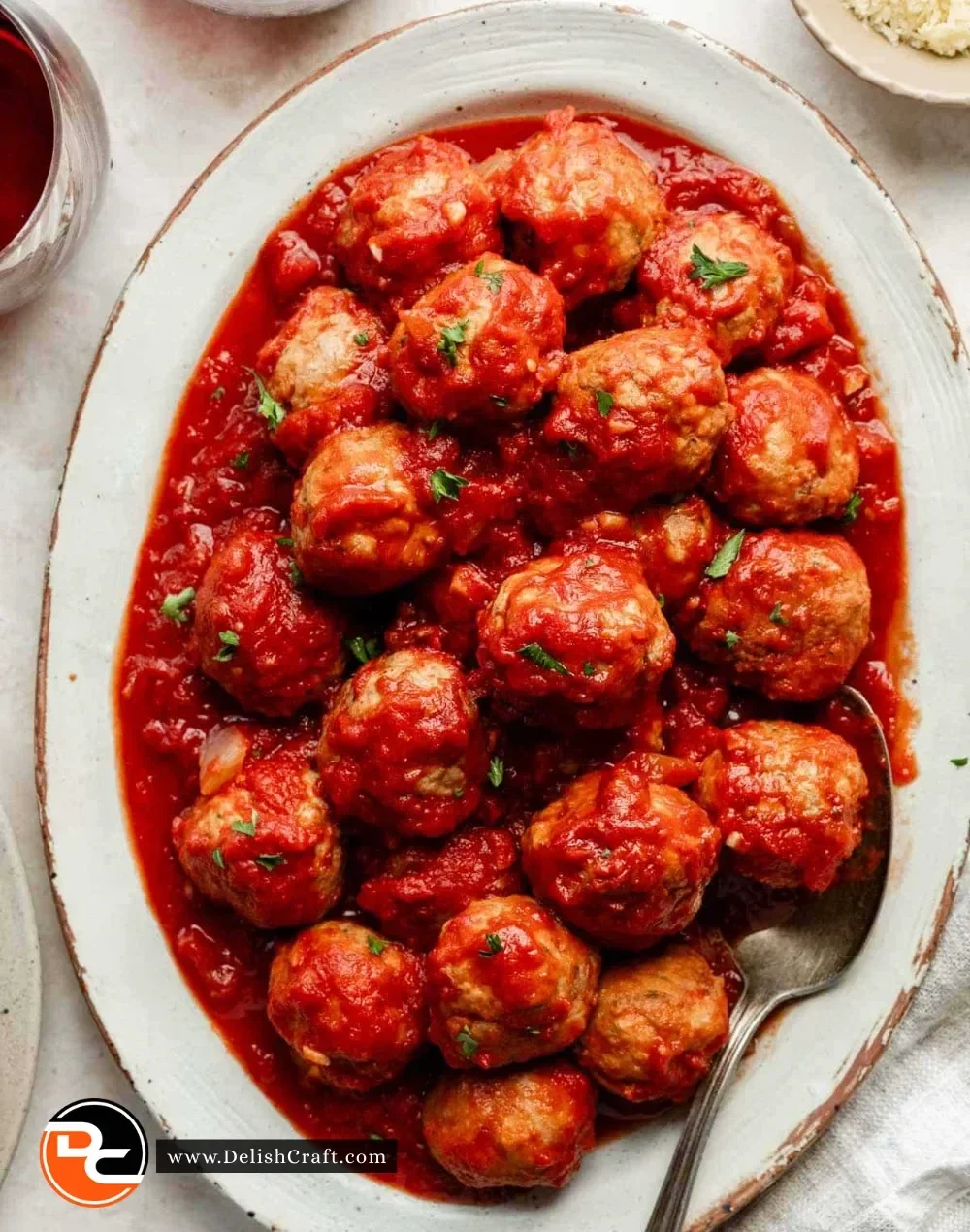 Slow cooker turkey meatballs served with marinara sauce and parsley garnish