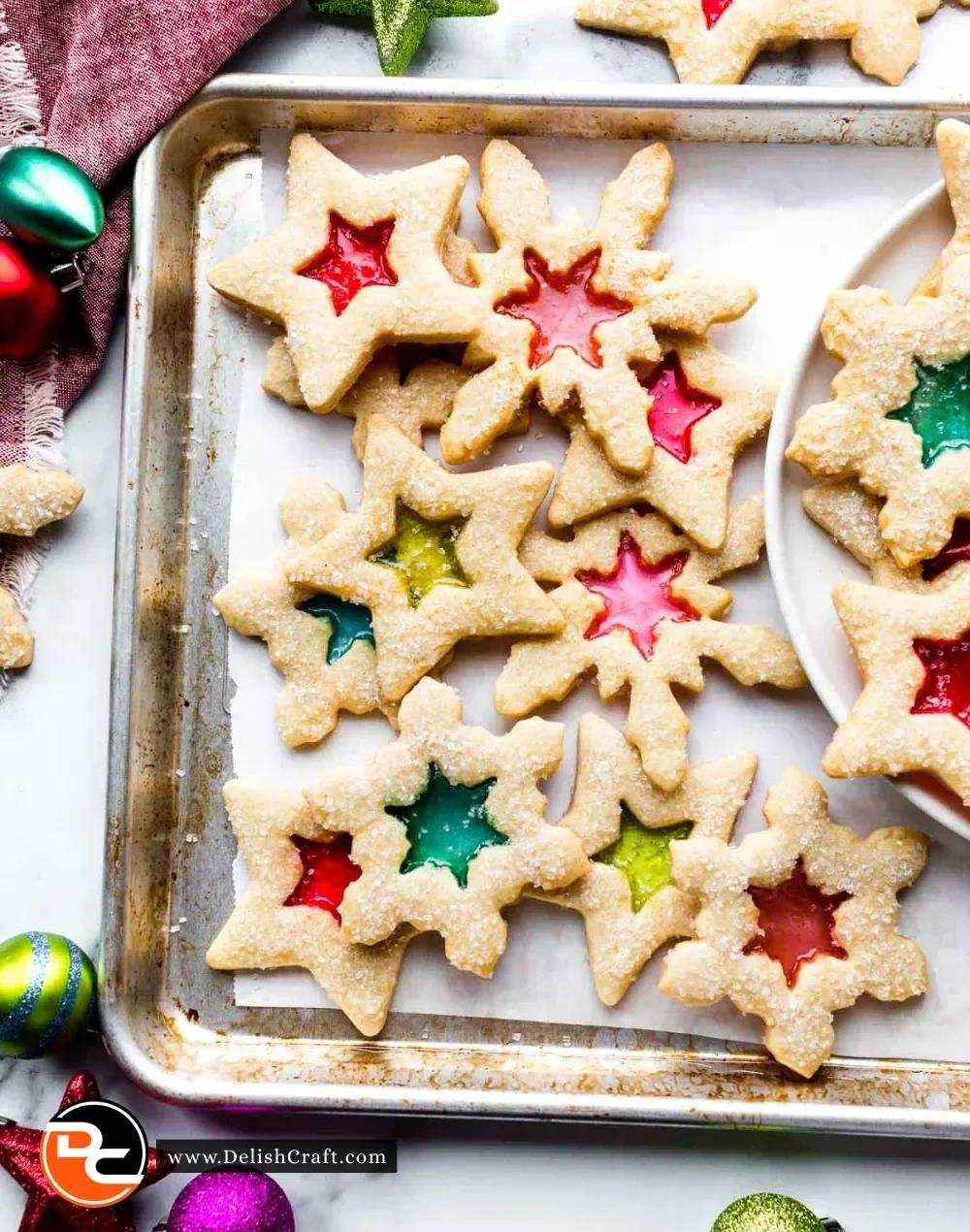 Colorful stained glass window cookies on a baking tray