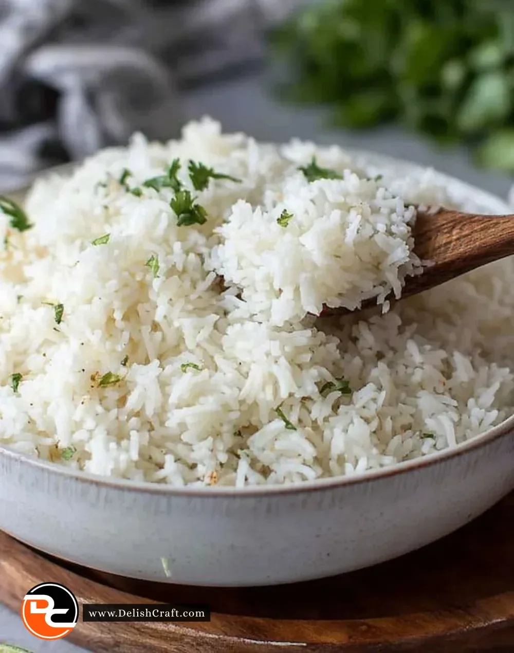 Delicious coconut rice served in a bowl with fresh herbs and coconut flakes.