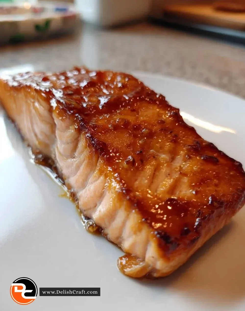 Plate of 20-Minute Maple Soy Salmon garnished with green onions and sesame seeds