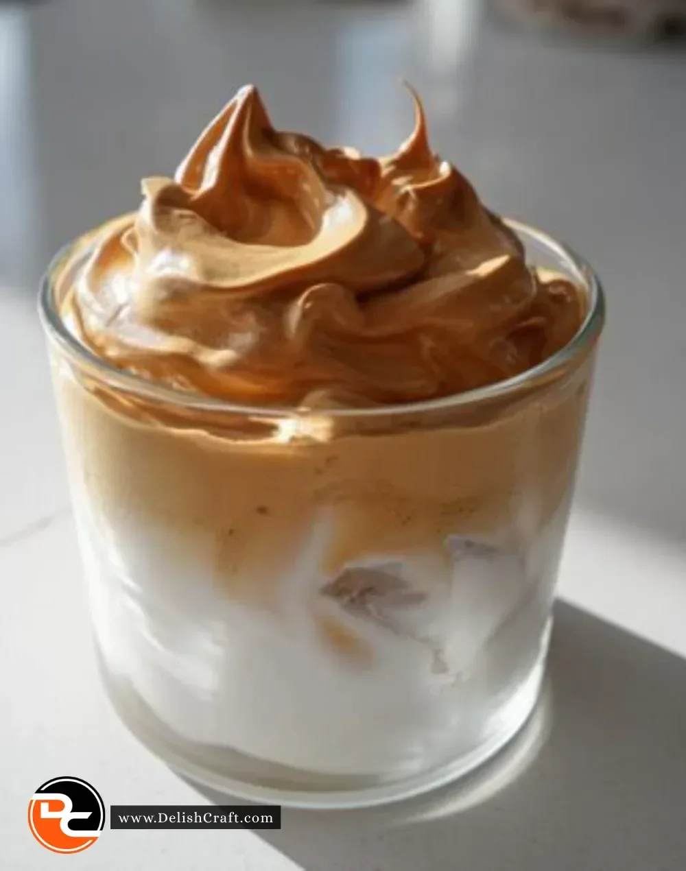 Deliciously whipped Dalgona coffee served in a glass cup