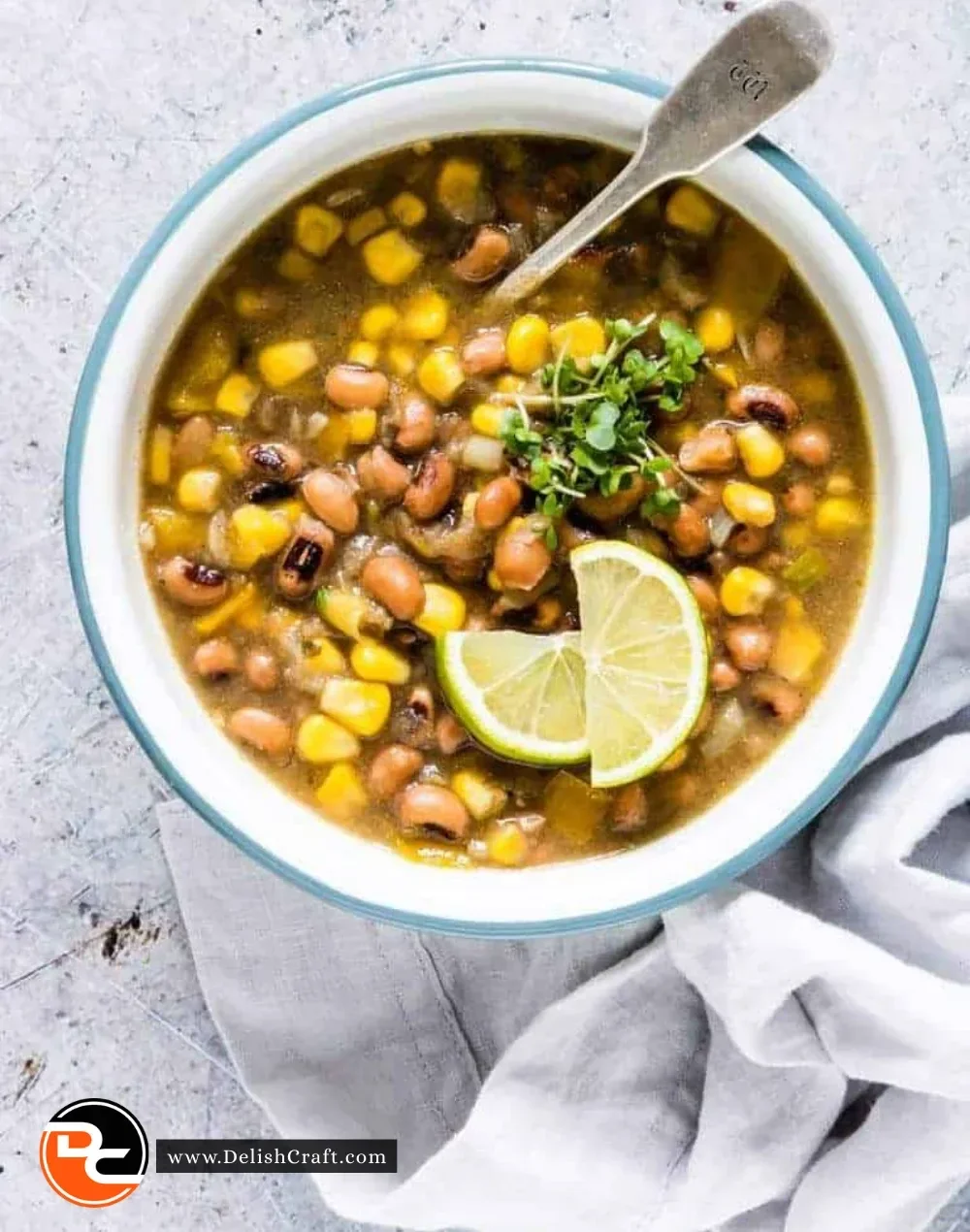 A hearty bowl of black eyed peas bean soup garnished with herbs and spices