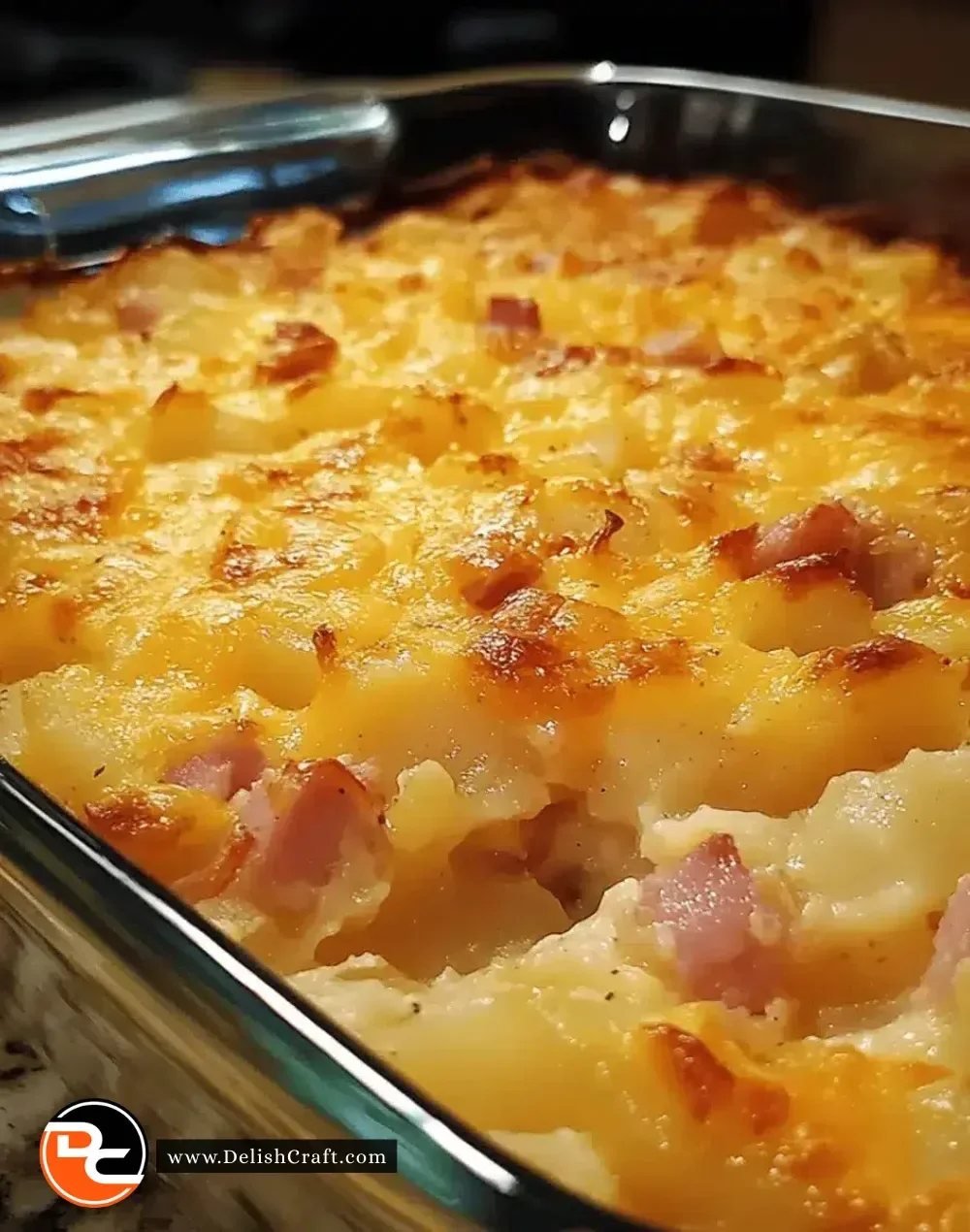Delicious cheesy ham potato casserole served in a baking dish