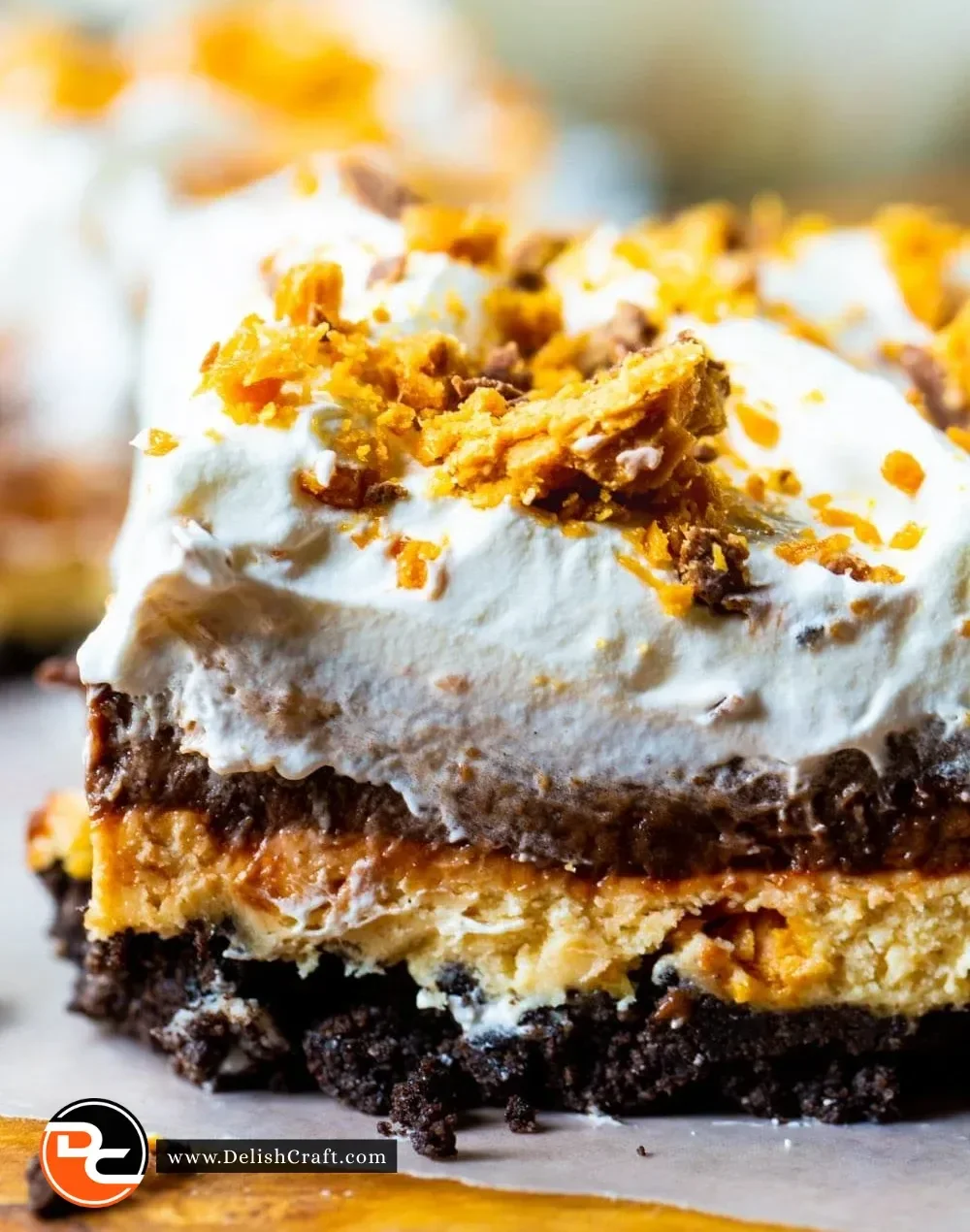 Butterfinger Lush dessert with chocolate and peanut butter layers
