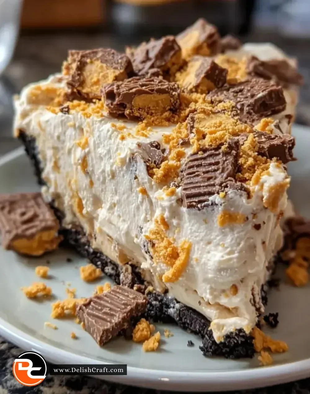 Delicious Butterfinger Peanut Butter Pie topped with chocolate and crushed Butterfinger candies