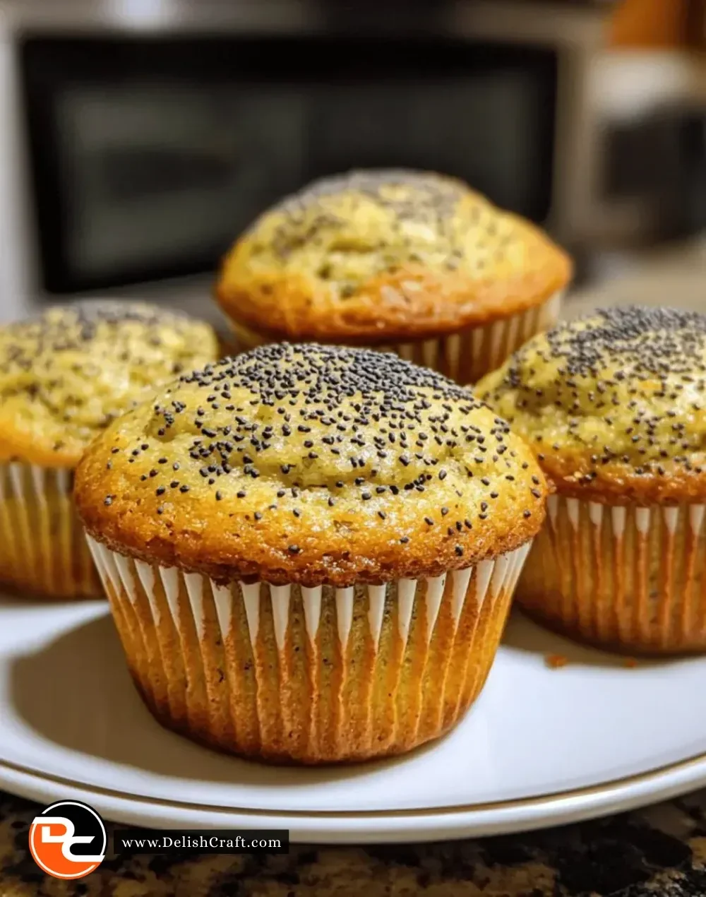 Freshly baked vegan lemon poppy seed muffins on a cooling rack