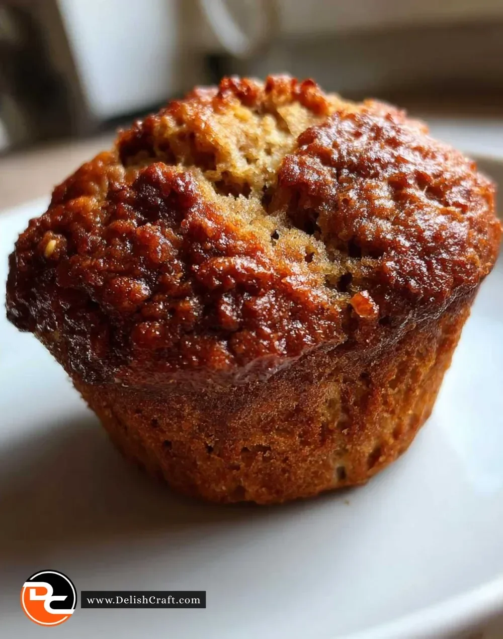 Freshly baked fluffy vegan banana muffins on a cooling rack.