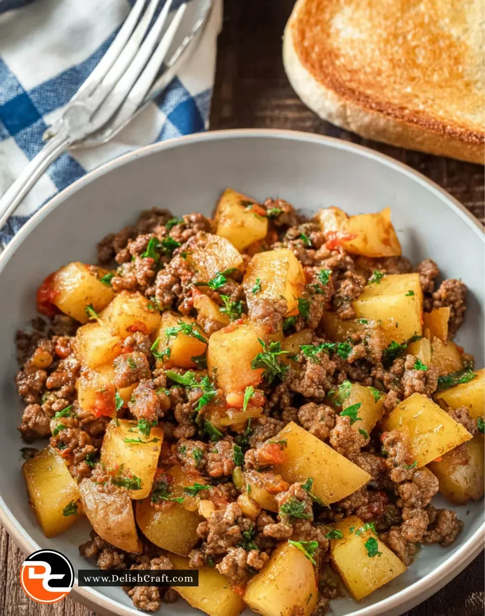 Ground Beef and Potato Skillet served in a skillet with herbs.