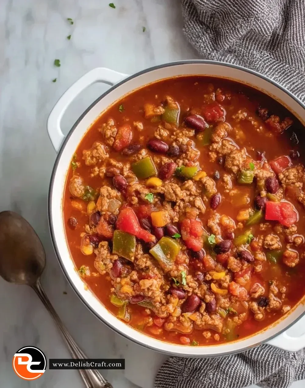 Bowl of hearty turkey vegetable chili topped with fresh herbs