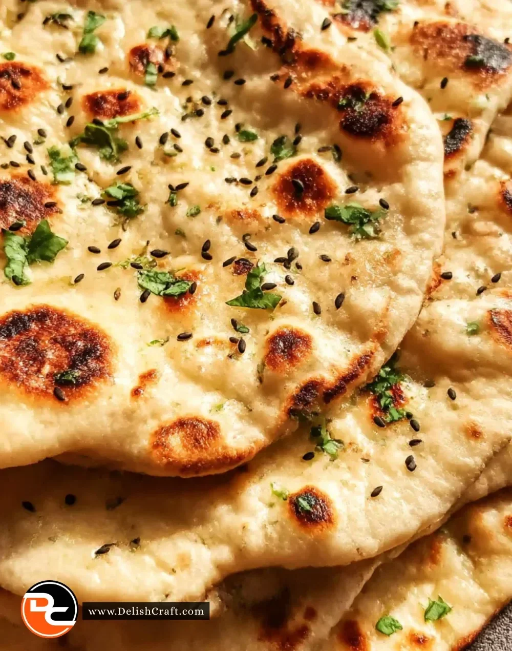 Freshly baked homemade naan bread on a wooden table