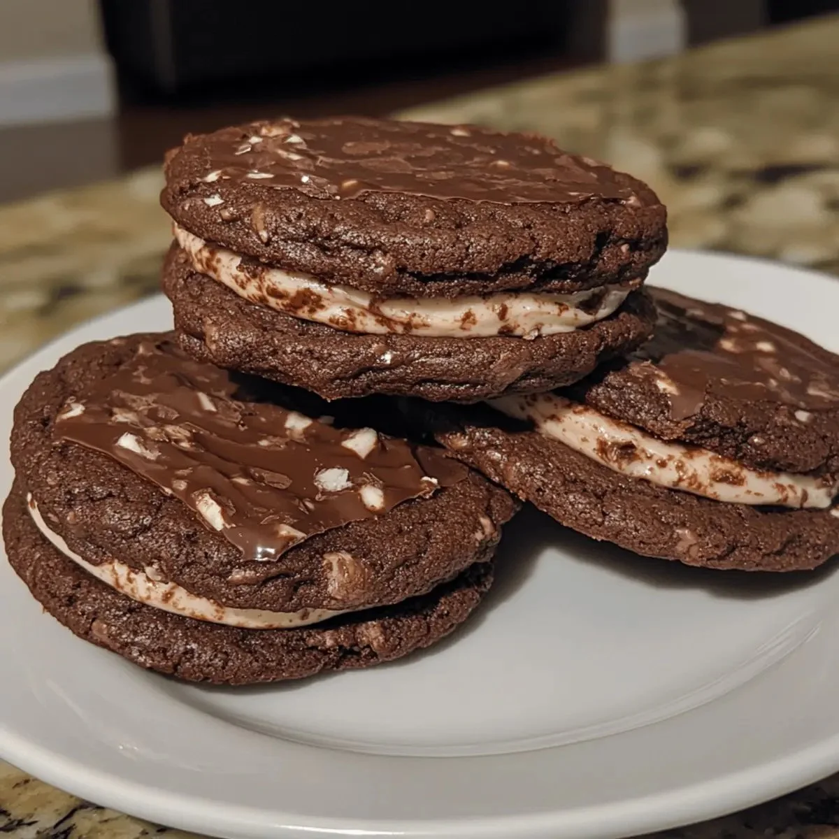 Irresistible double chocolate cookie sandwiches stacked for a delicious dessert