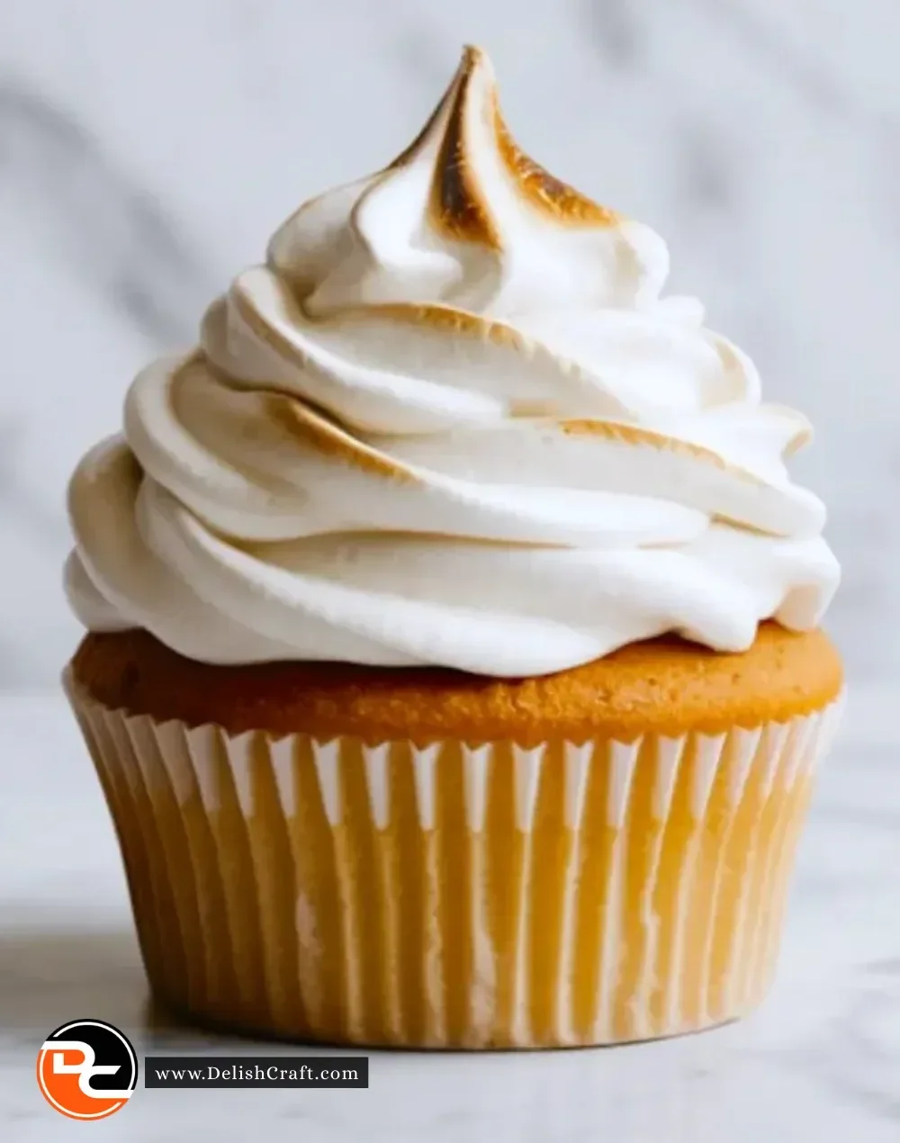 A bowl of homemade marshmallow frosting ready to top cakes and cupcakes.