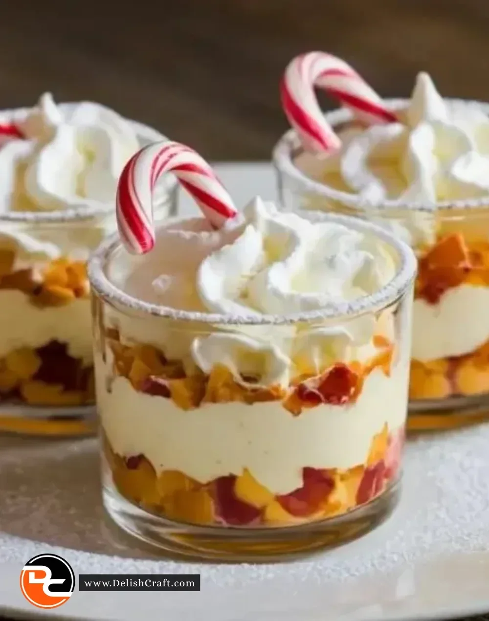 Mini Christmas Trifles with layers of cream and festive fruits