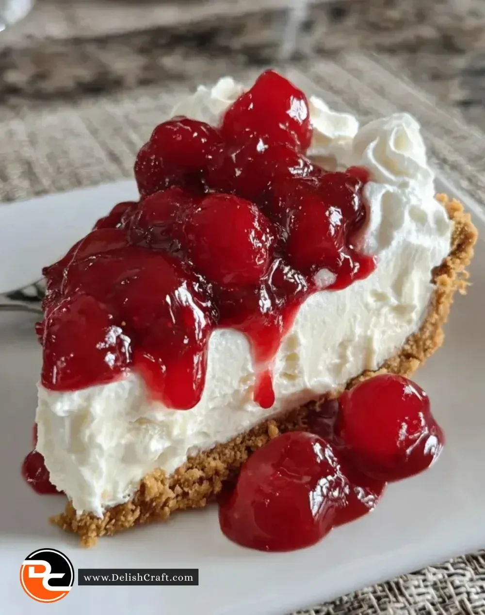 Delicious no-bake cherry cheesecake topped with cherry sauce