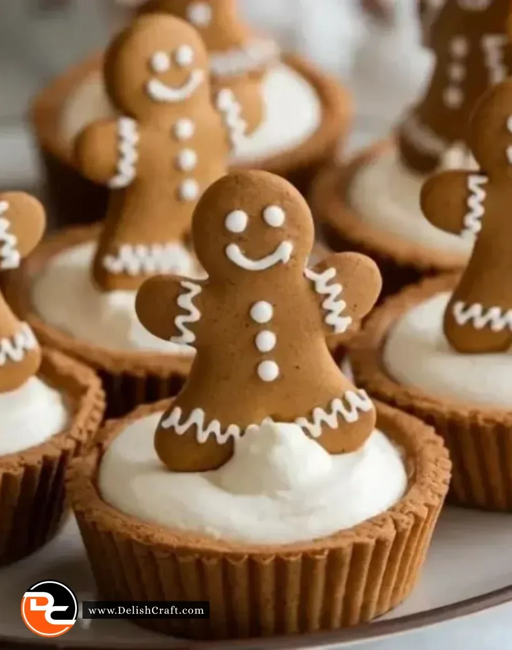 No-bake gingerbread cheesecake cups topped with whipped cream and spices
