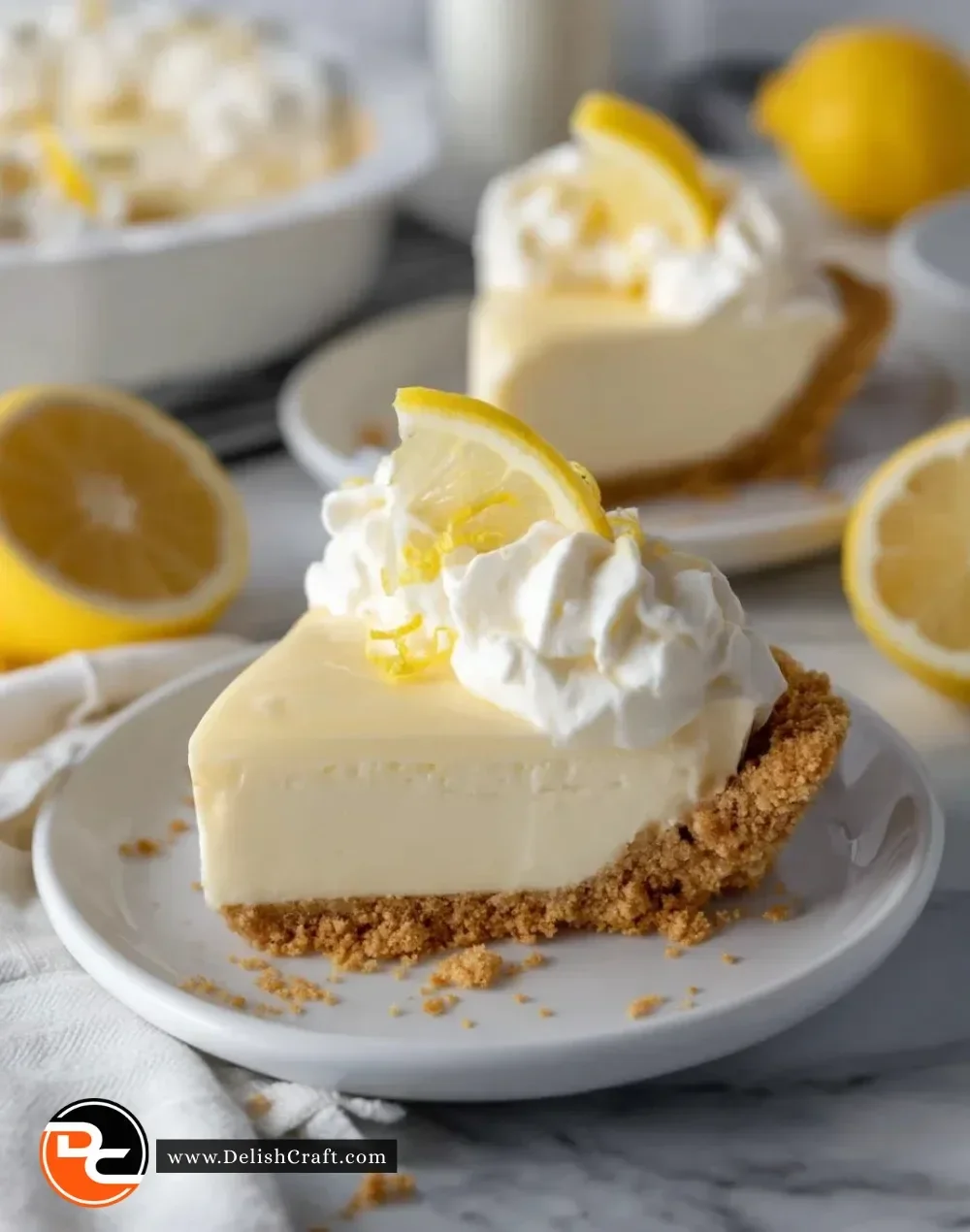 Delicious no bake lemon pie topped with whipped cream and lemon zest