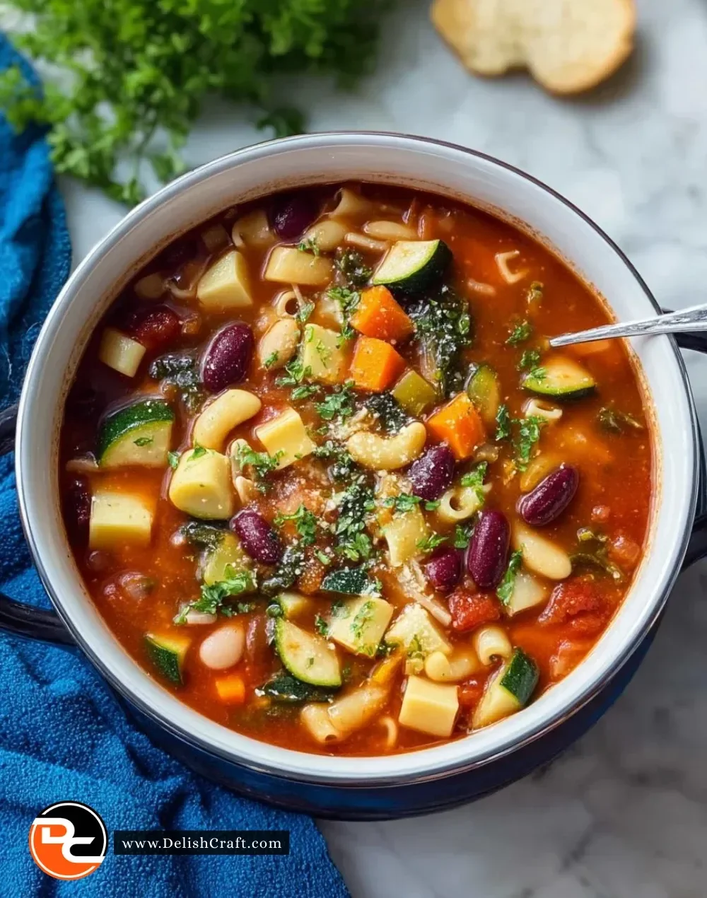 Bowl of Olive Garden minestrone soup filled with veggies and beans