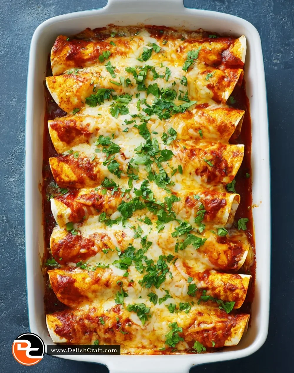 Plate of Over-the-Border Shrimp Enchiladas topped with fresh cilantro and cheese