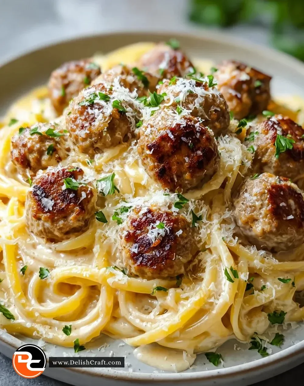 Parmesan Linguine with garlic butter meatballs served on a plate