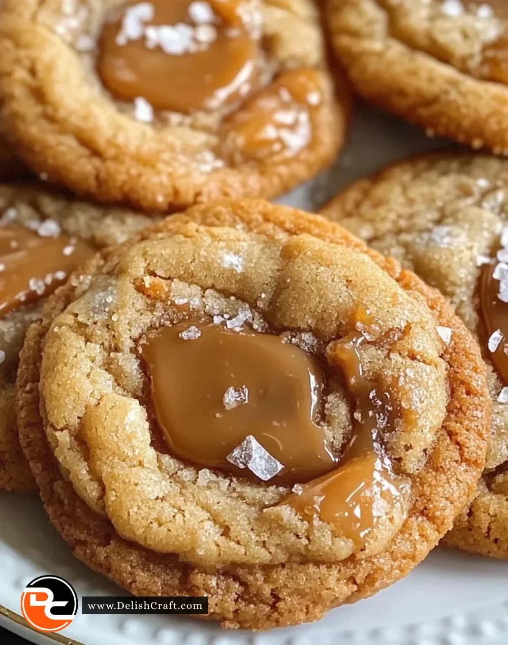 Freshly baked salted caramel cookies with a sprinkle of sea salt on top.