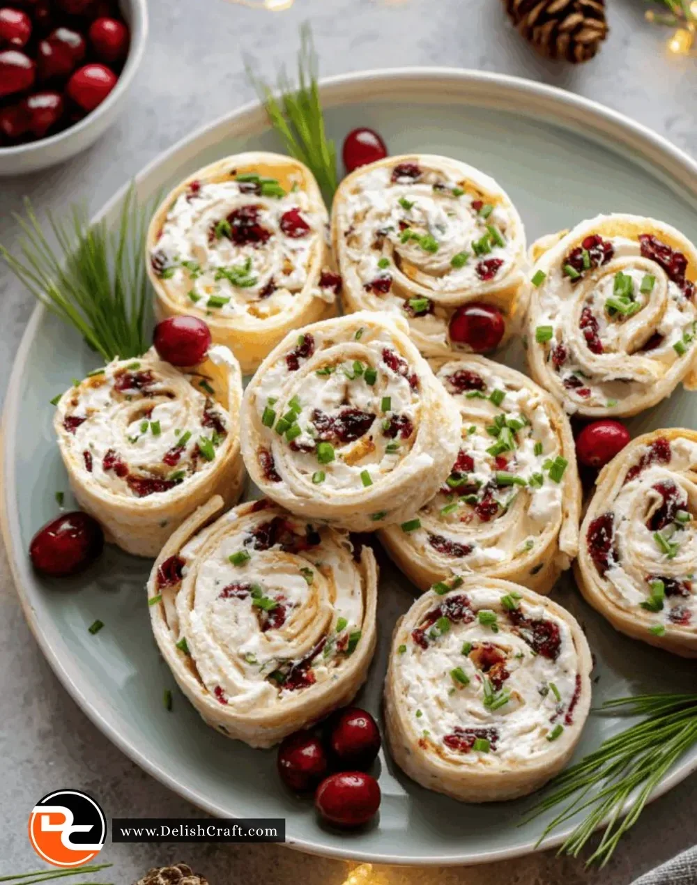 Savory Christmas Cranberry Roll Ups served on a holiday platter