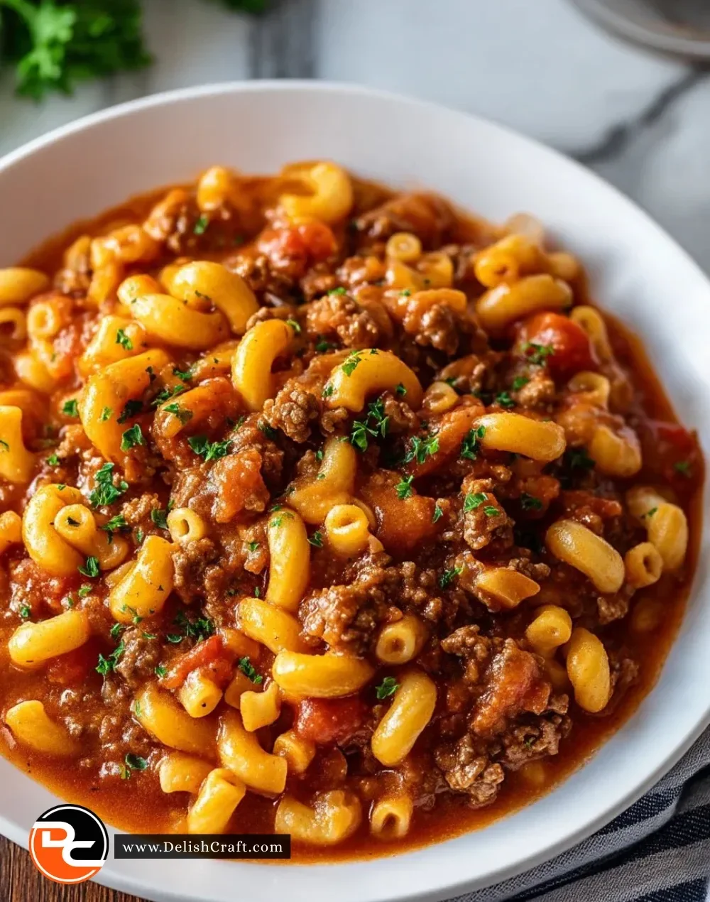 Delicious Southern Style Goulash with pasta, meat, and spices served in a bowl.
