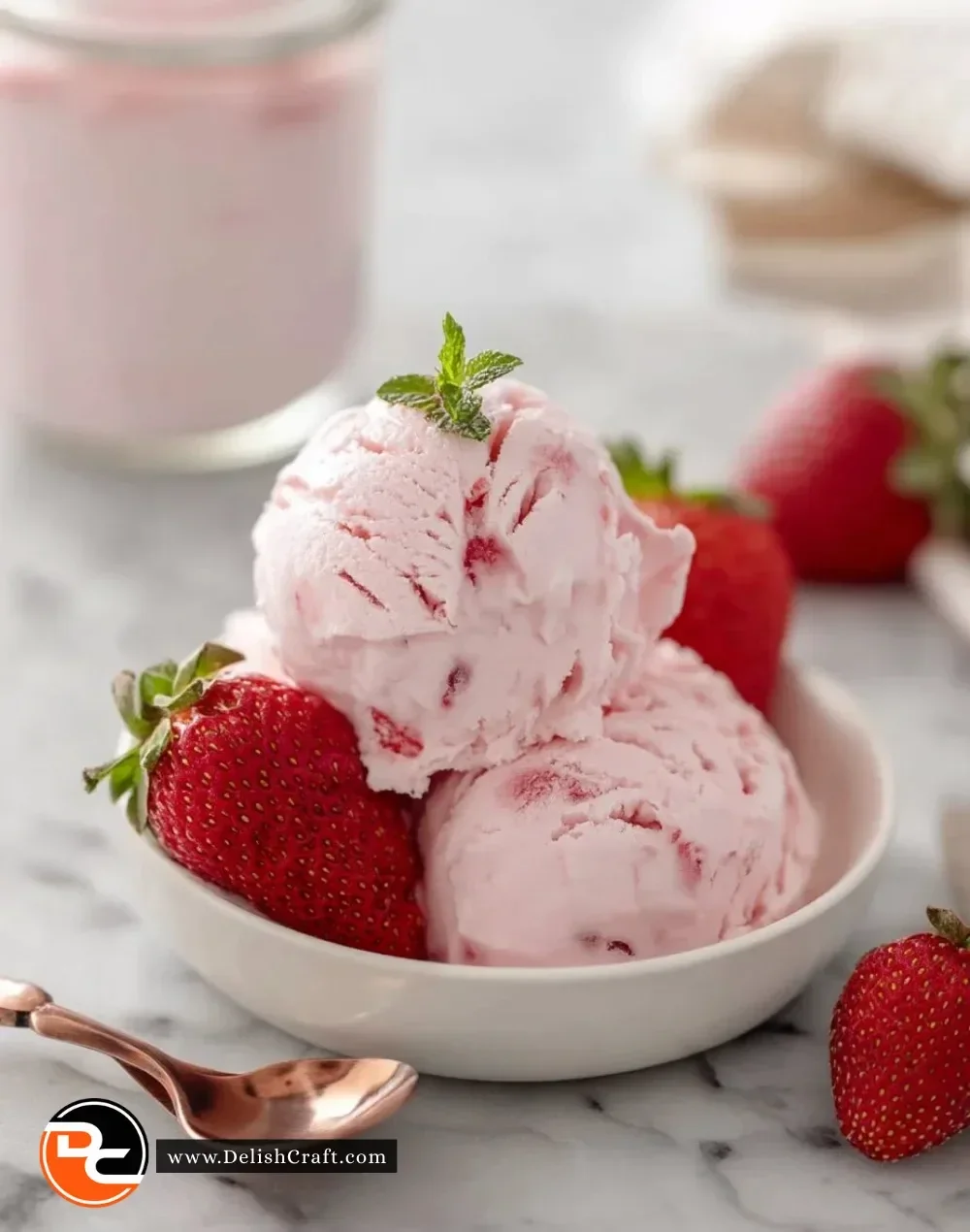 Delicious strawberry cottage cheese ice cream in a bowl with fresh strawberries