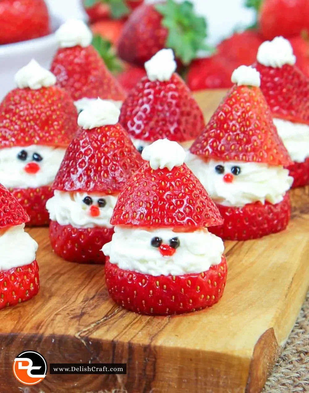Festive Strawberry Santas decorated with whipped cream and chocolate.