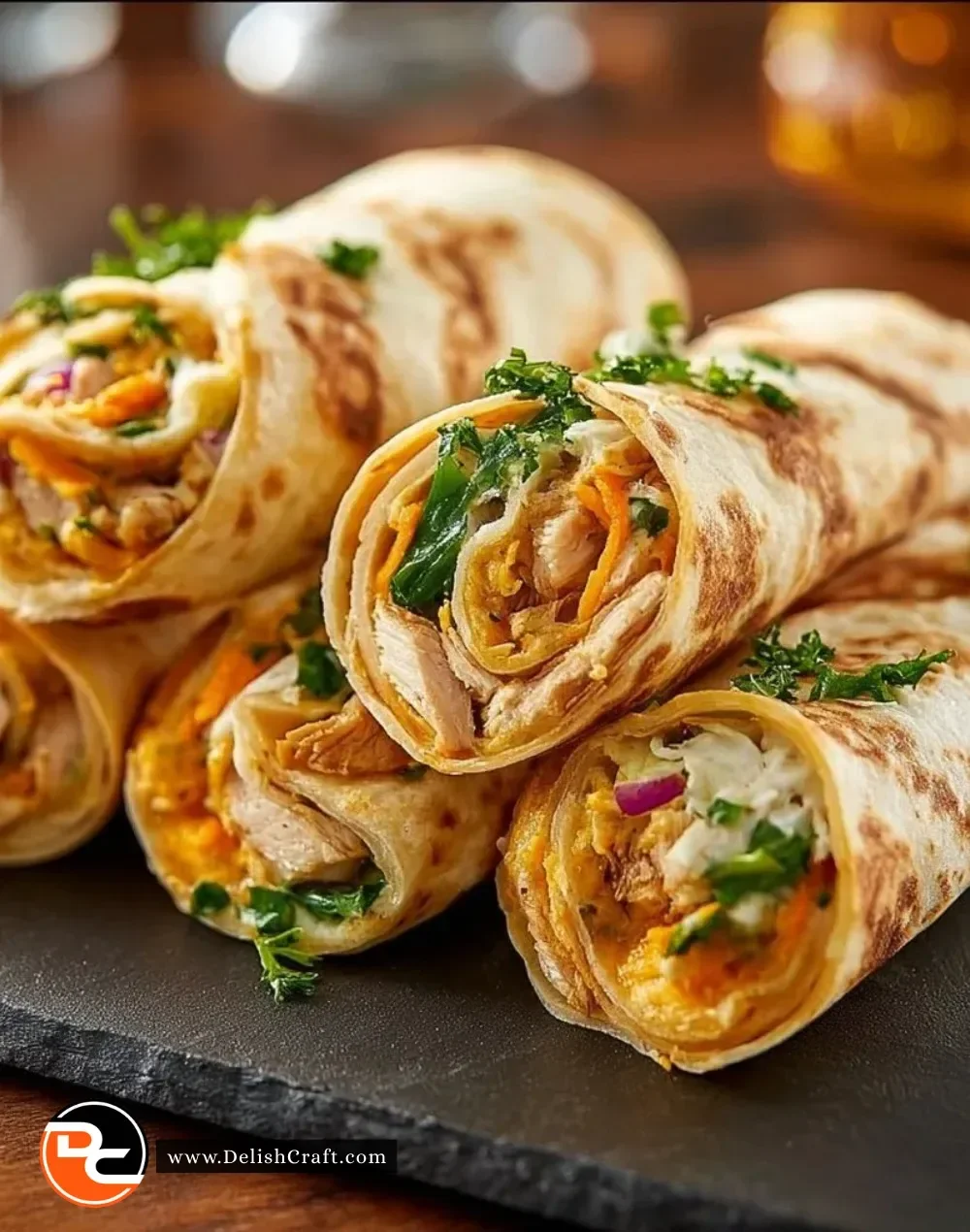 Platter of colorful tortilla roll-ups filled with fresh ingredients