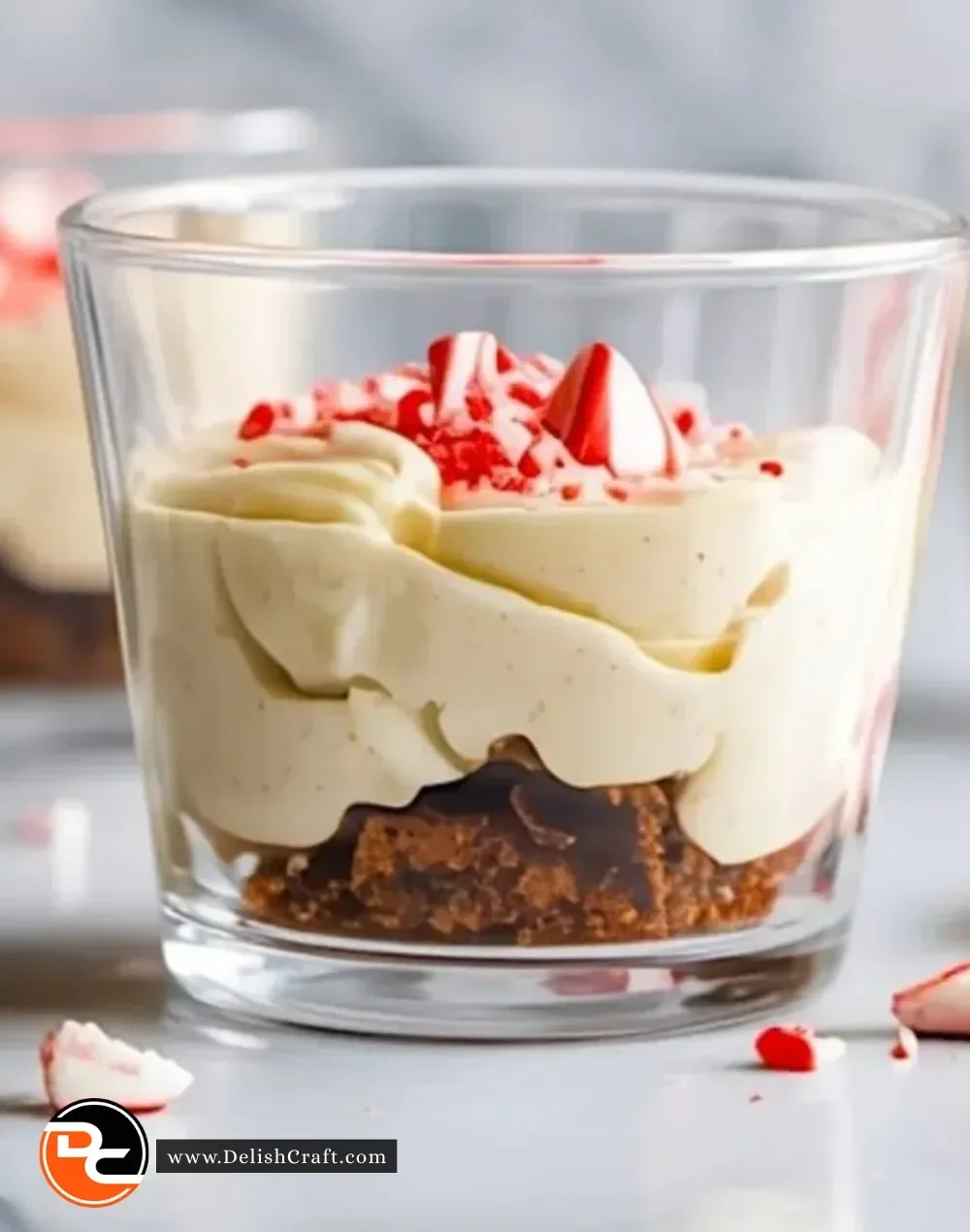 Delicious white chocolate peppermint bark mousse in a festive serving dish.