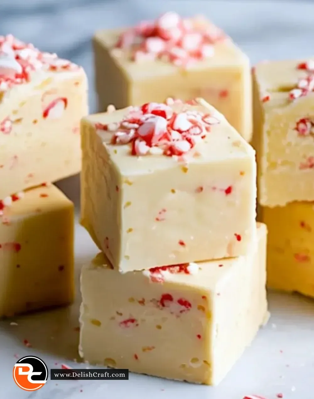 White chocolate peppermint fudge dessert with festive holiday decorations.