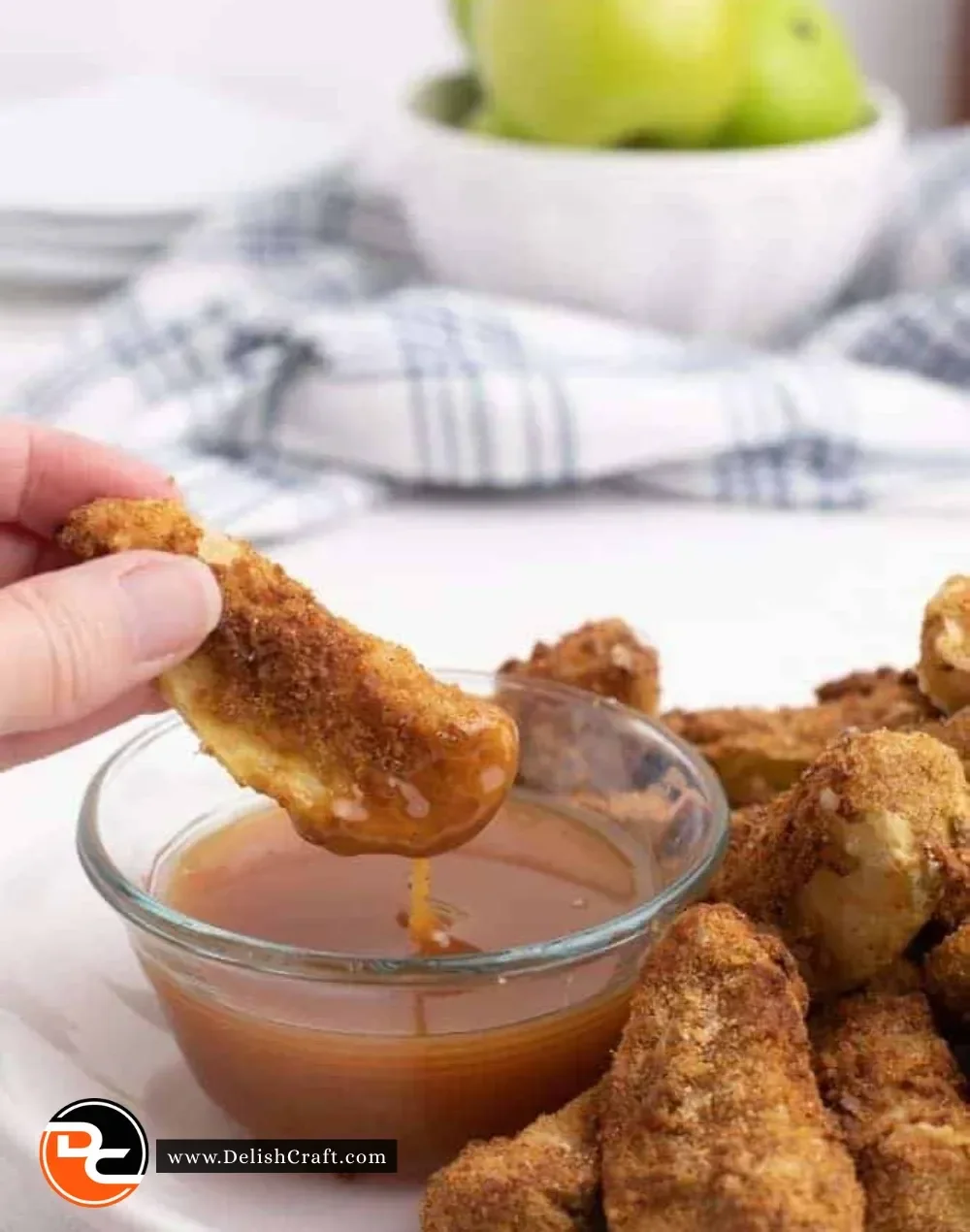 Crispy air fryer apple slices served in a bowl with cinnamon sprinkles