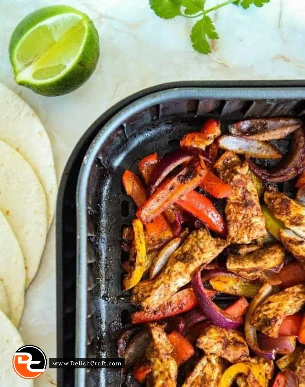 Air Fryer Chicken Fajitas with peppers and onions served on a plate