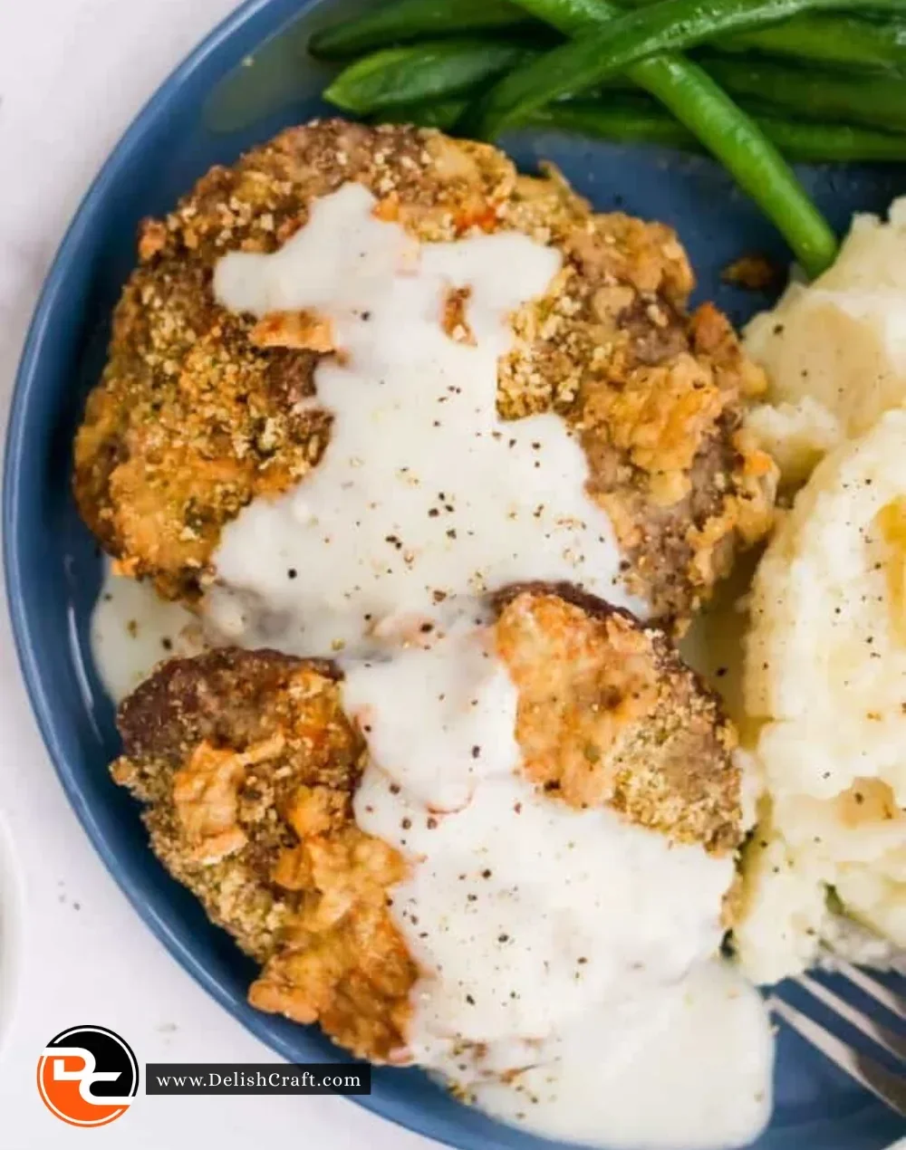 Air Fryer Chicken Fried Steak served with gravy and sides