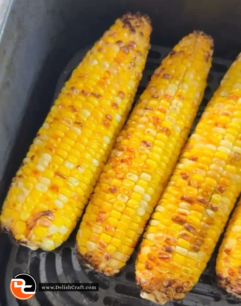 Air Fryer Corn on the Cob served with butter and herbs