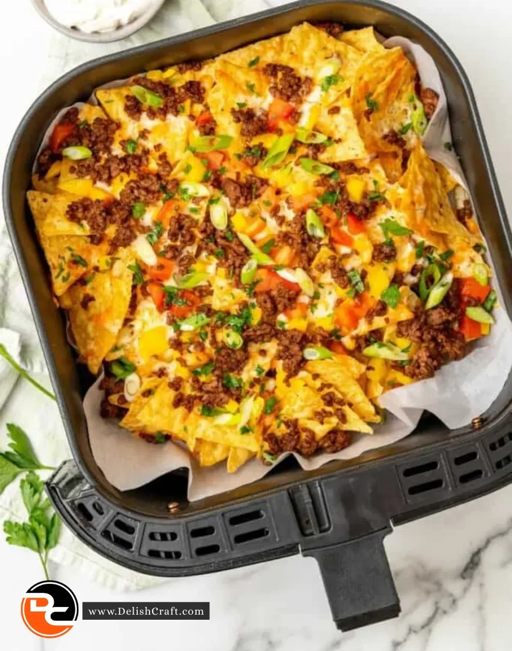 Delicious Air Fryer Nachos with melted cheese and toppings