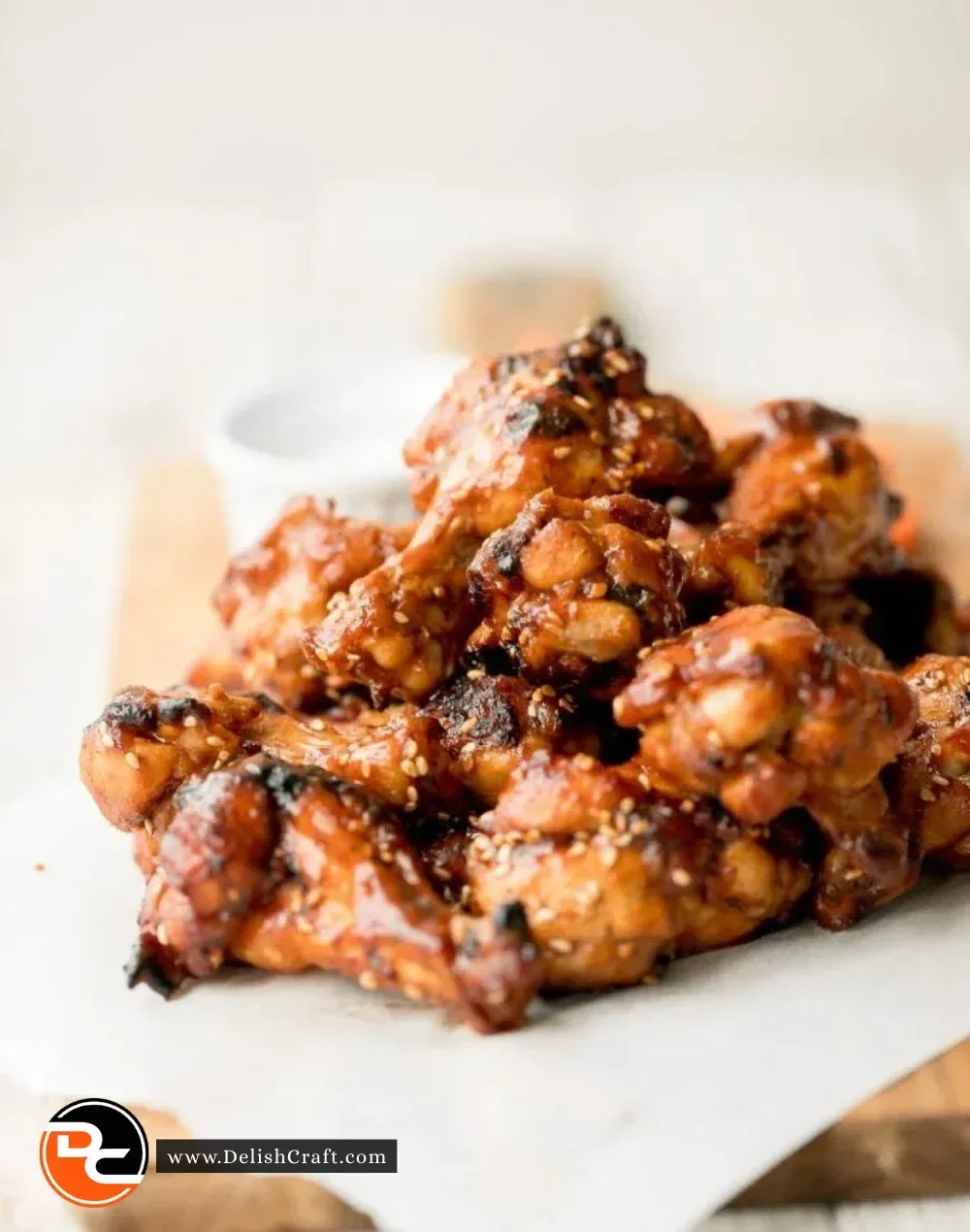 Delicious baked BBQ chicken wings topped with barbecue sauce