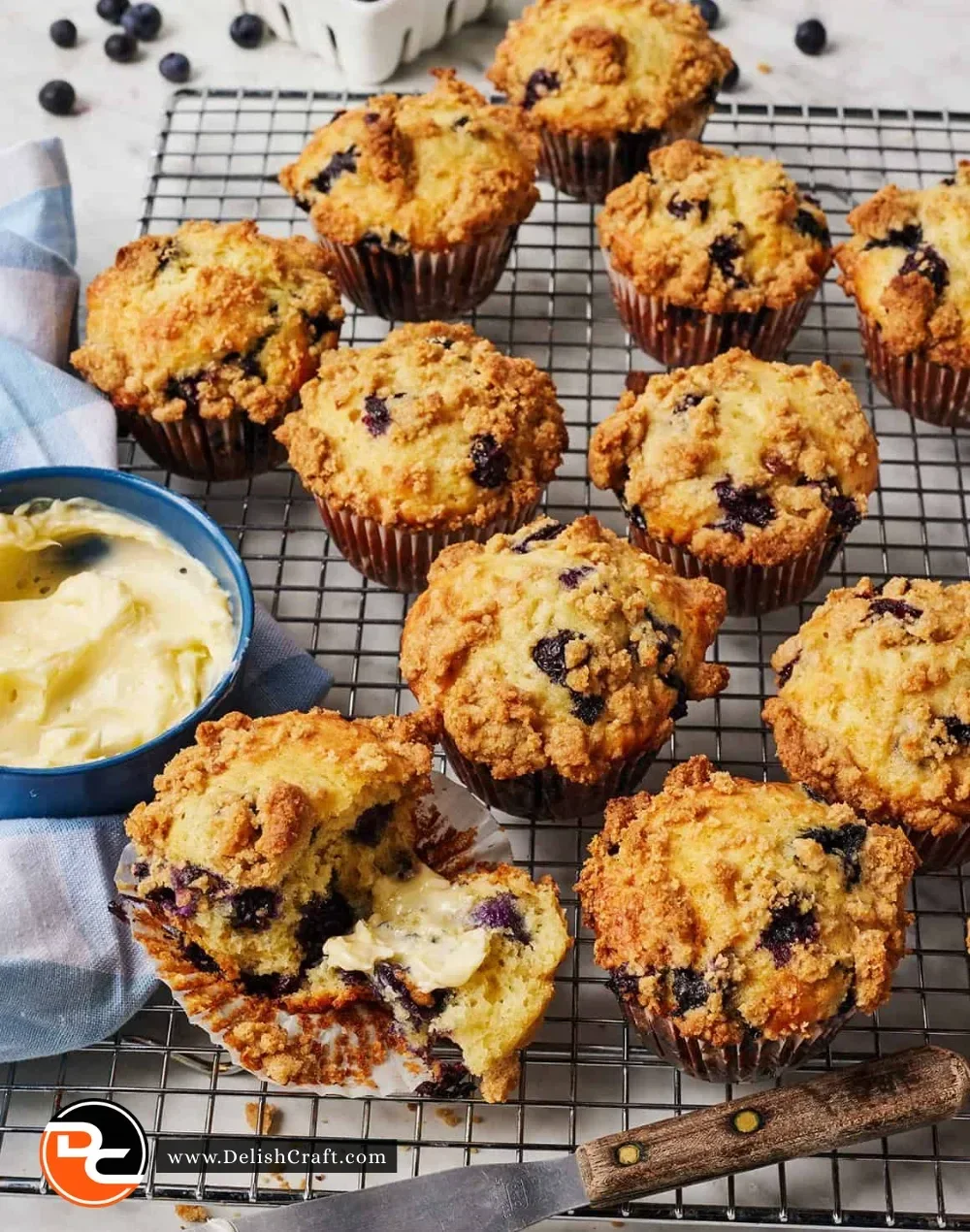 Freshly baked blueberry muffins topped with plump blueberries