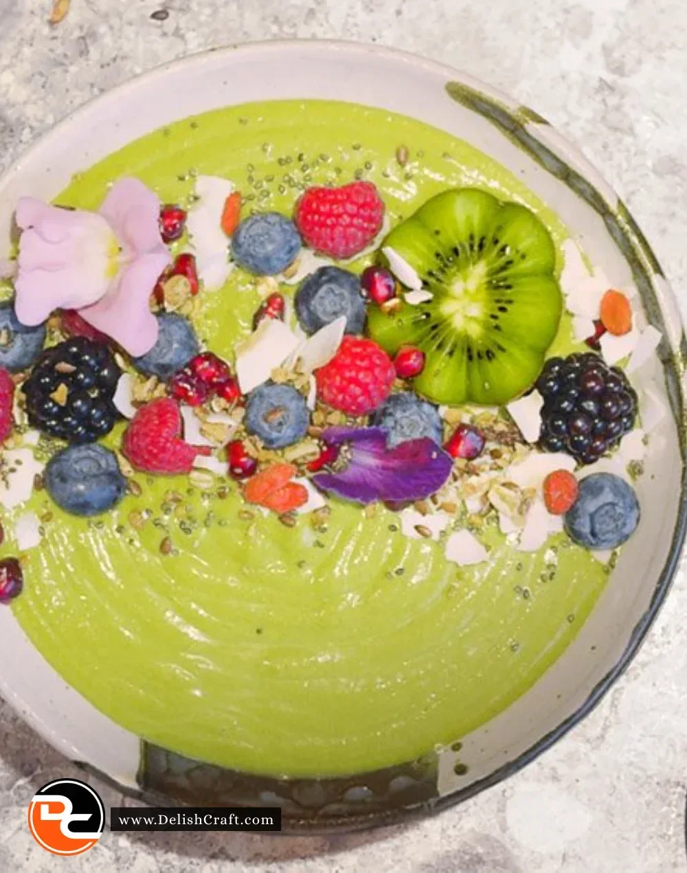 Breakfast fruit bowl with fresh mango and matcha powder for a healthy start