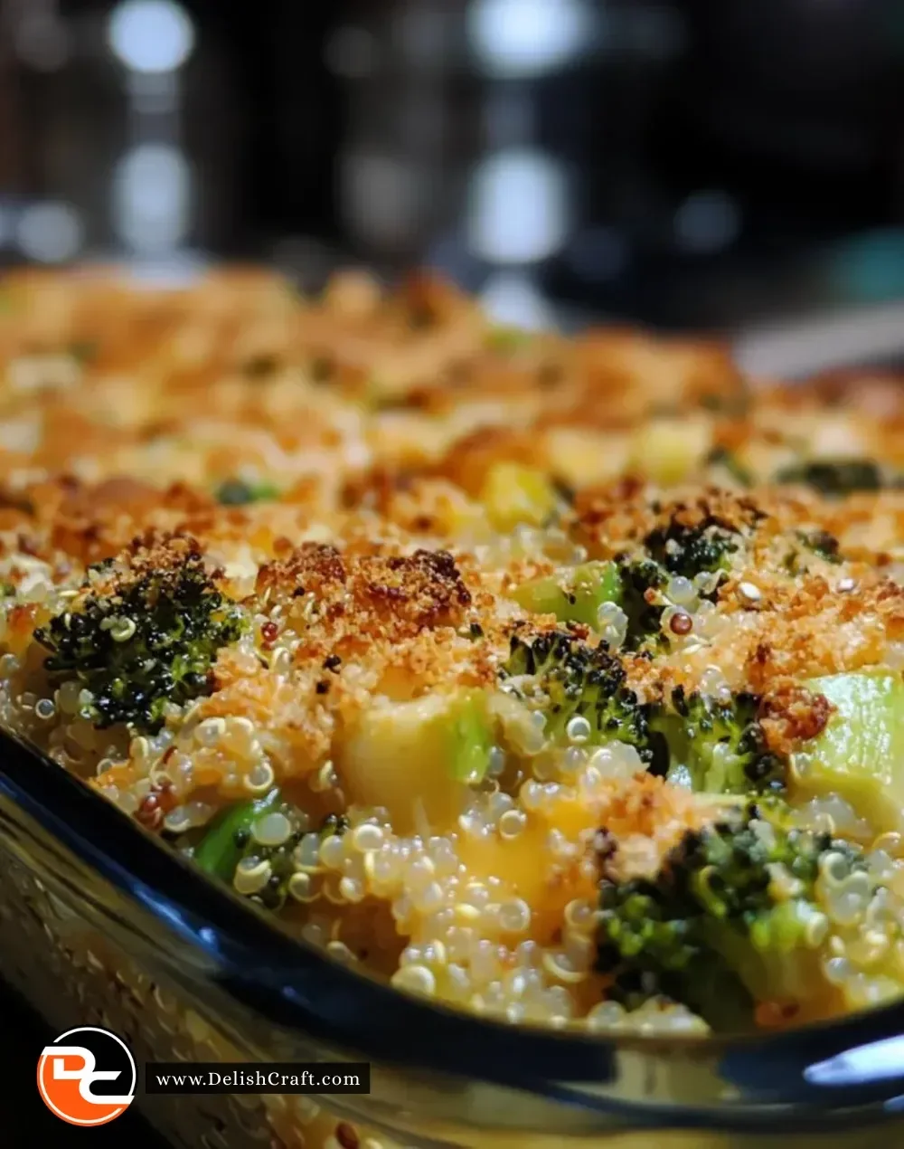 Delicious broccoli cheddar quinoa bake in a casserole dish, topped with melted cheese.