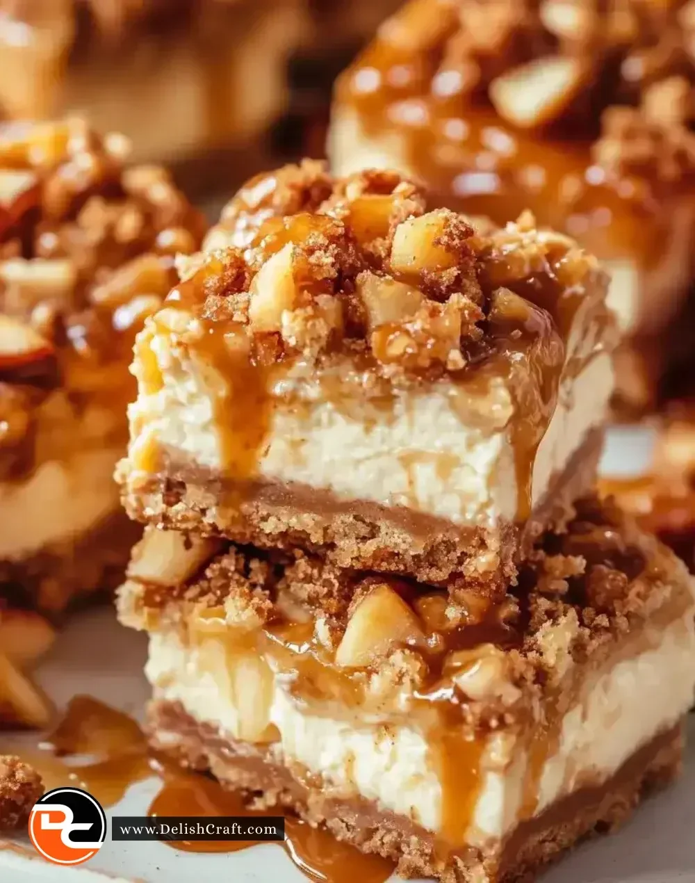 Delicious Caramel Apple Cheesecake Bars topped with caramel drizzle.