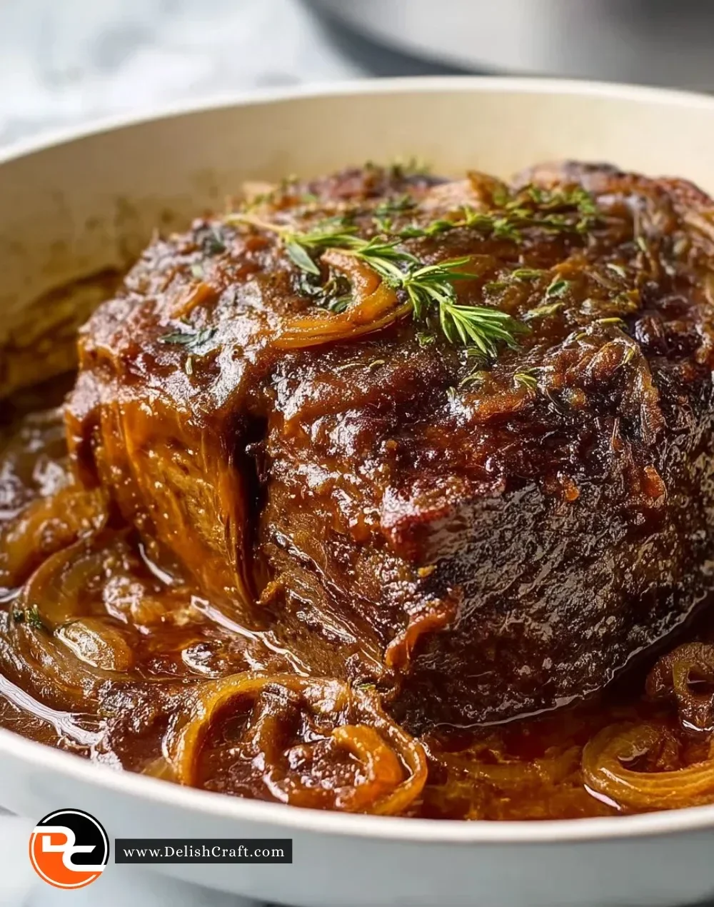 Delicious Caramelized French Onion Pot Roast served on a rustic wooden table.