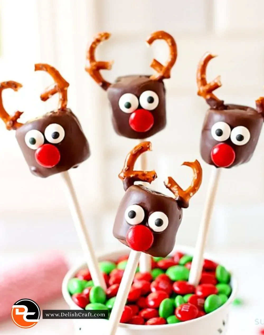 Chocolate covered marshmallow reindeer decorated with festive accents