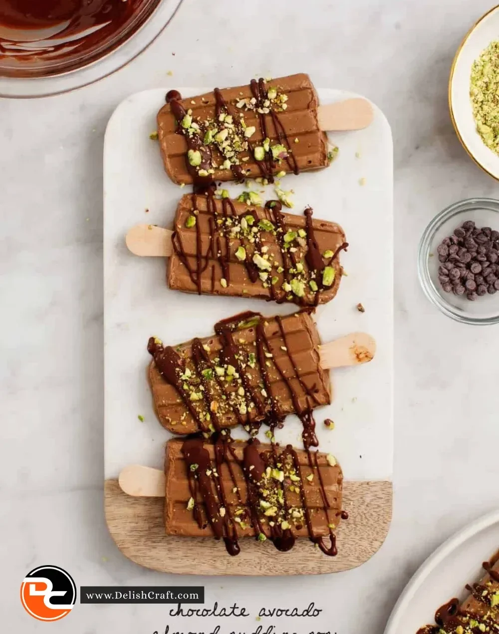 Delicious chocolate pudding pops served in colorful molds, perfect summer treat.