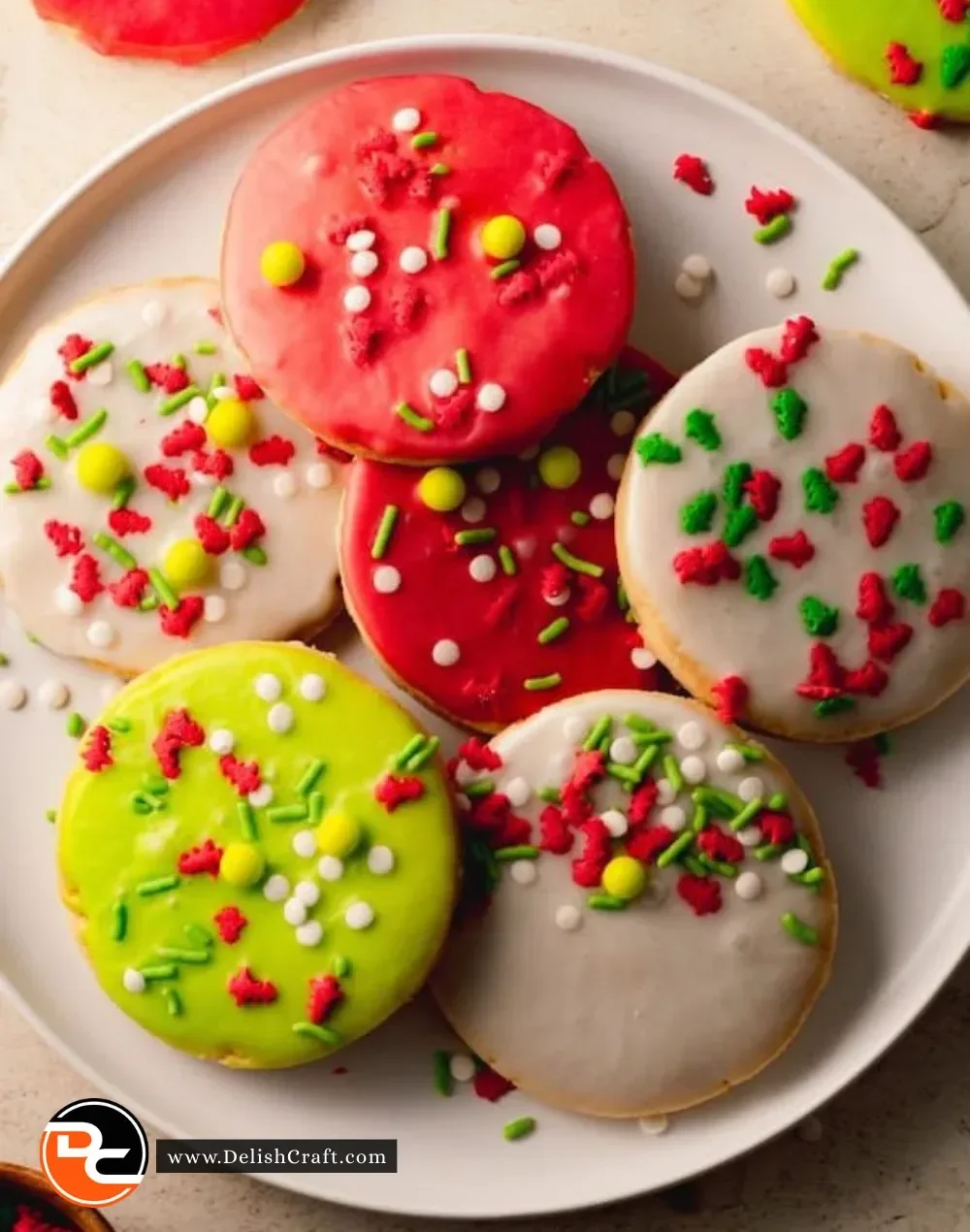 Decorated Christmas cut-out shortbread cookies on a festive plate