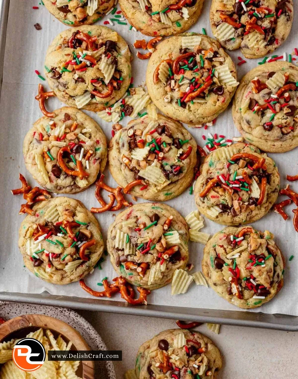 Assorted Christmas kitchen sink cookies with chocolate chips and festive decorations.