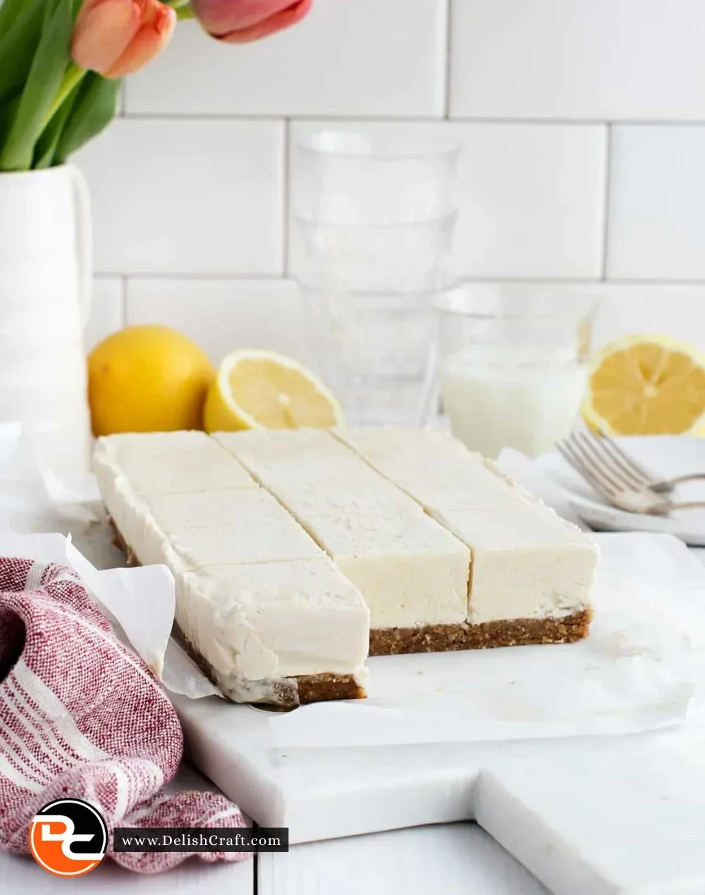 Creamy vegan lemon bars topped with lemon zest, a delicious dairy-free dessert.